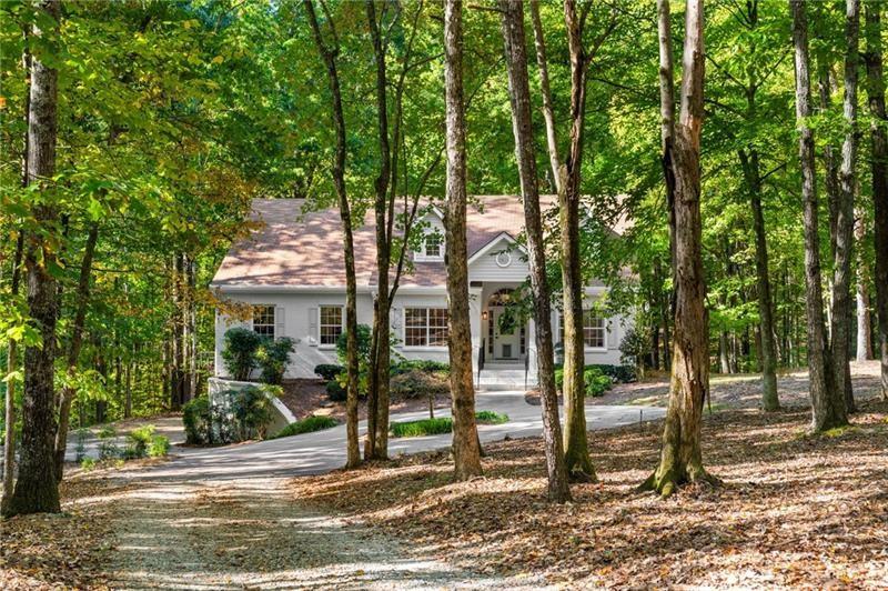 16218 Henderson Road Milton, GA 30004 - Photo 4 of 81 a view of a park that has large trees