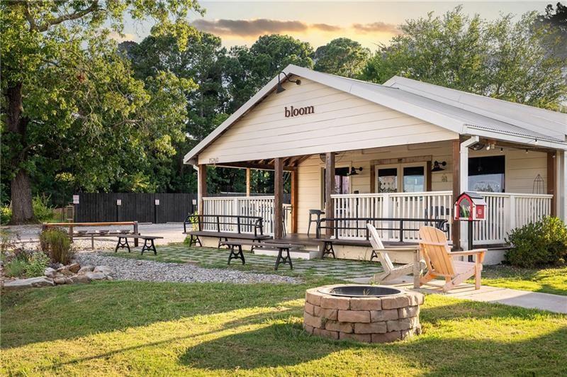 16218 Henderson Road Milton, GA 30004 - Photo 61 of 81 a front view of house with yard and outdoor seating
