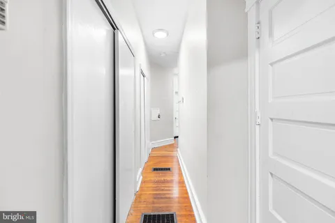 a view of a hallway with a white walls