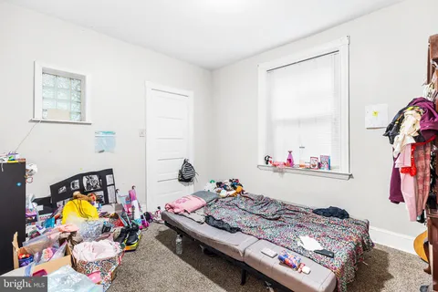 a bed room with a bed and a window