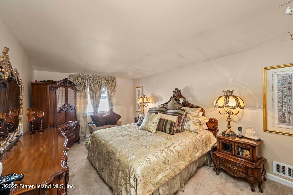 53 Plymouth Road Staten Island, NY 10314 - Photo 12 of 23 a bed room with a bed and a tv