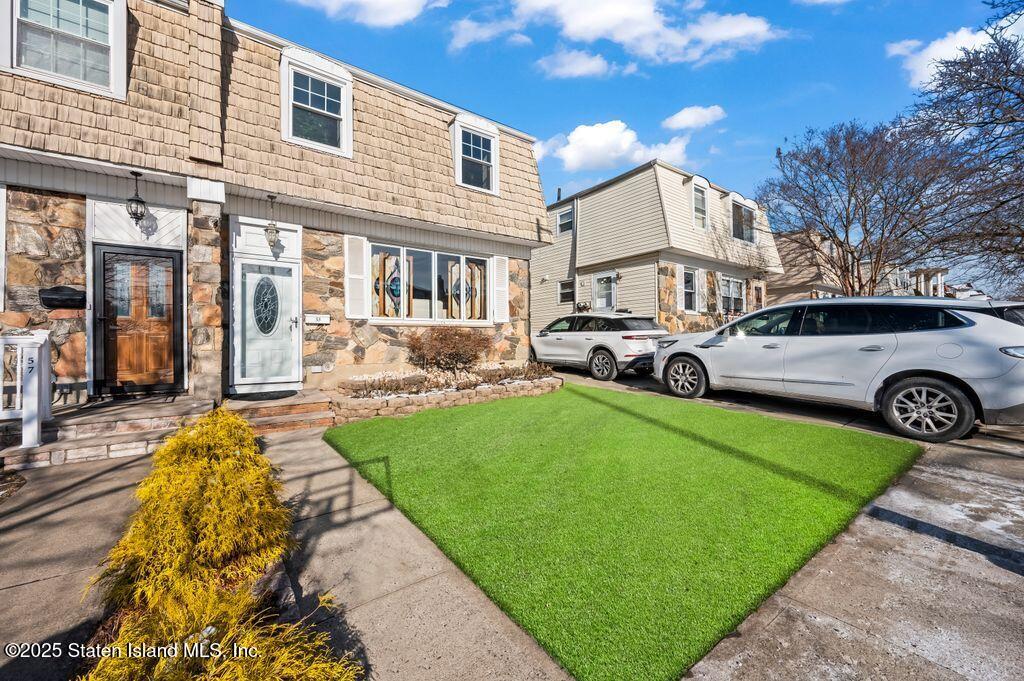 53 Plymouth Road Staten Island, NY 10314 - Photo 2 of 23 a front view of a house with garden