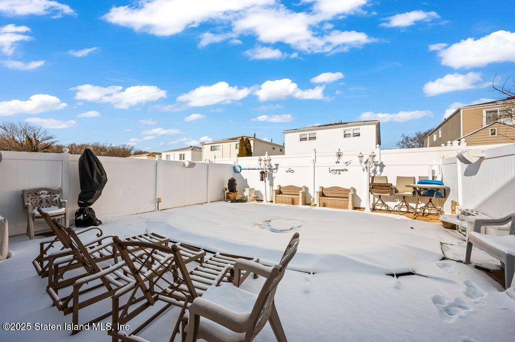 53 Plymouth Road Staten Island, NY 10314 - Photo 22 of 23 a view of a terrace with furniture and stove