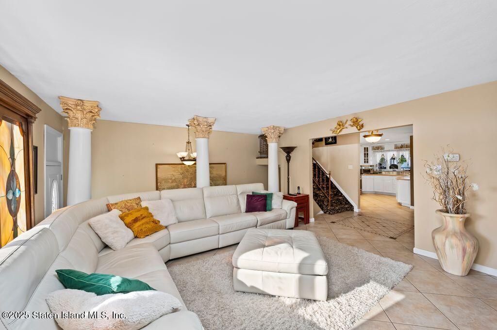 53 Plymouth Road Staten Island, NY 10314 - Photo 5 of 23 a living room with furniture and a wooden floor