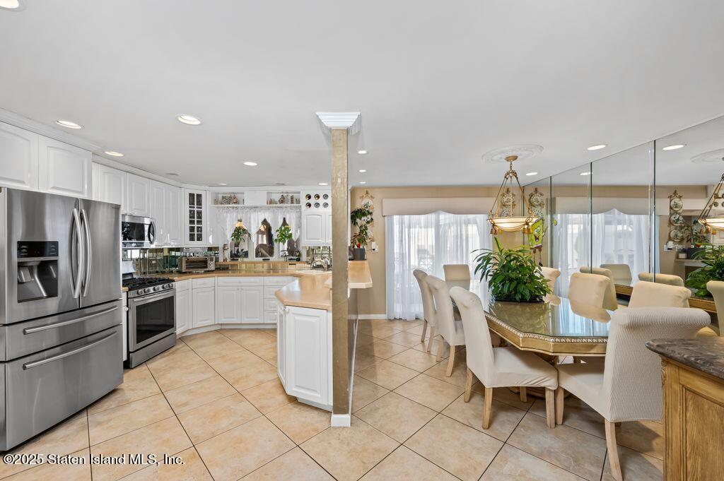 53 Plymouth Road Staten Island, NY 10314 - Photo 7 of 23 a kitchen with counter space cabinets and appliances