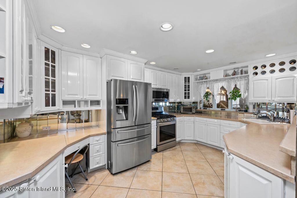 53 Plymouth Road Staten Island, NY 10314 - Photo 8 of 23 a kitchen with a refrigerator and a sink