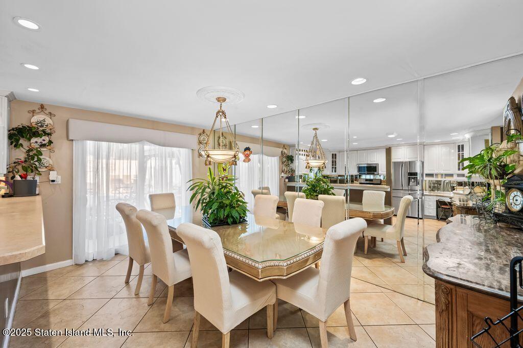 53 Plymouth Road Staten Island, NY 10314 - Photo 9 of 23 a view of a dining room with furniture window and outside view