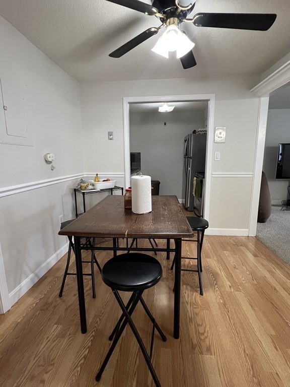 1186 Worcester Road, Unit 611 Framingham, MA 01702 - Photo 12 of 14 a view of a dining room with furniture and wooden floor