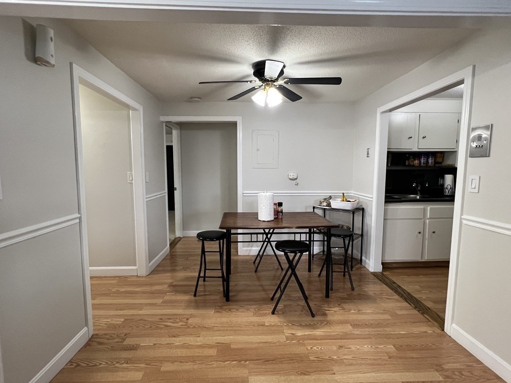 1186 Worcester Road, Unit 611 Framingham, MA 01702 - Photo 6 of 14 a view of a workspace with furniture and a kitchen