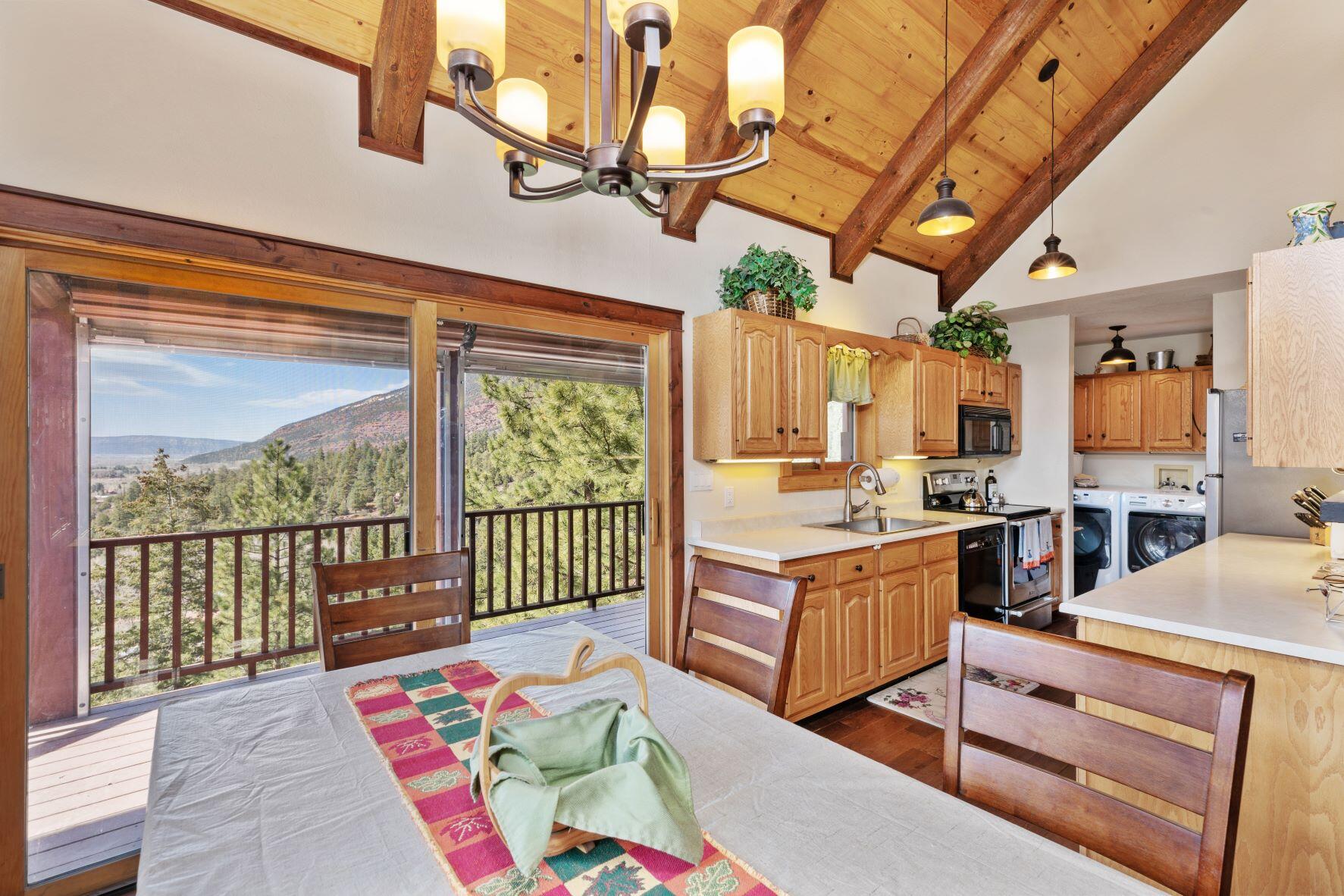 335 Red Stone Road Ridgway, CO 81432 - Photo 11 of 31 dining room kitchen north view