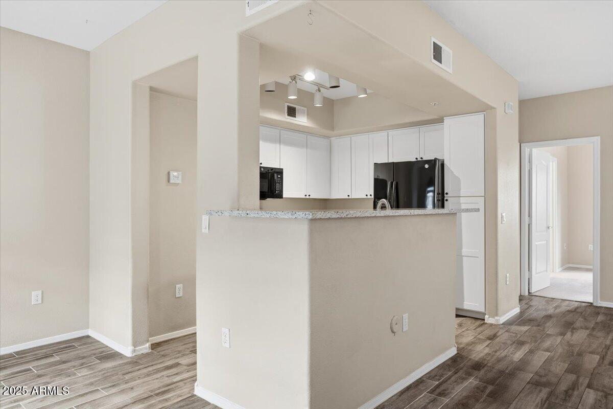 2401 East Rio Salado Parkway, Unit 1045 Tempe, AZ 85288 - Photo 13 of 41 a view of a kitchen with an empty space and a window