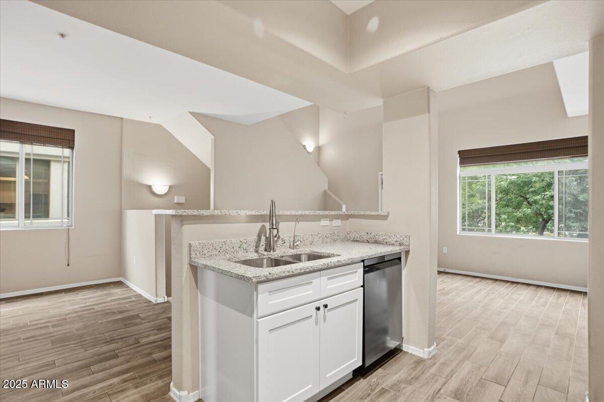 2401 East Rio Salado Parkway, Unit 1045 Tempe, AZ 85288 - Photo 15 of 41 a kitchen with a sink stove and wooden floor