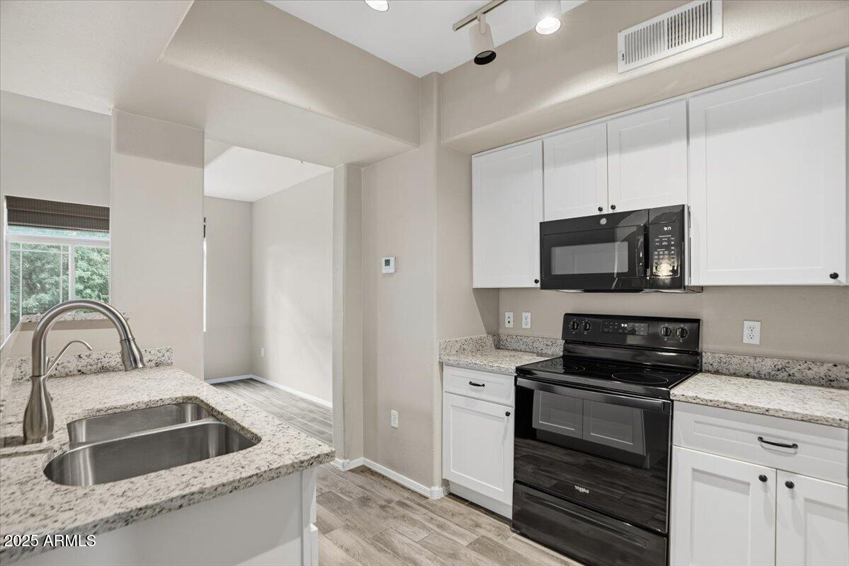 2401 East Rio Salado Parkway, Unit 1045 Tempe, AZ 85288 - Photo 16 of 41 a kitchen with a sink stove and microwave