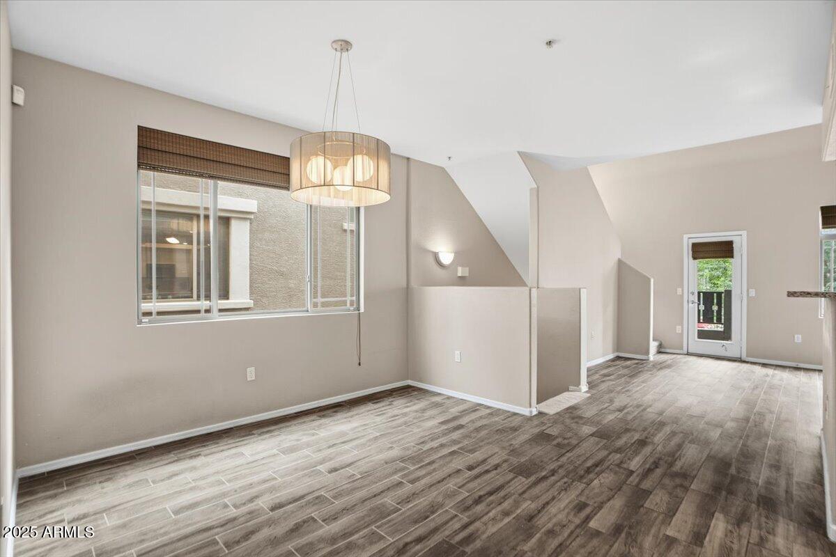 2401 East Rio Salado Parkway, Unit 1045 Tempe, AZ 85288 - Photo 19 of 41 a view of empty room with wooden floor and fan
