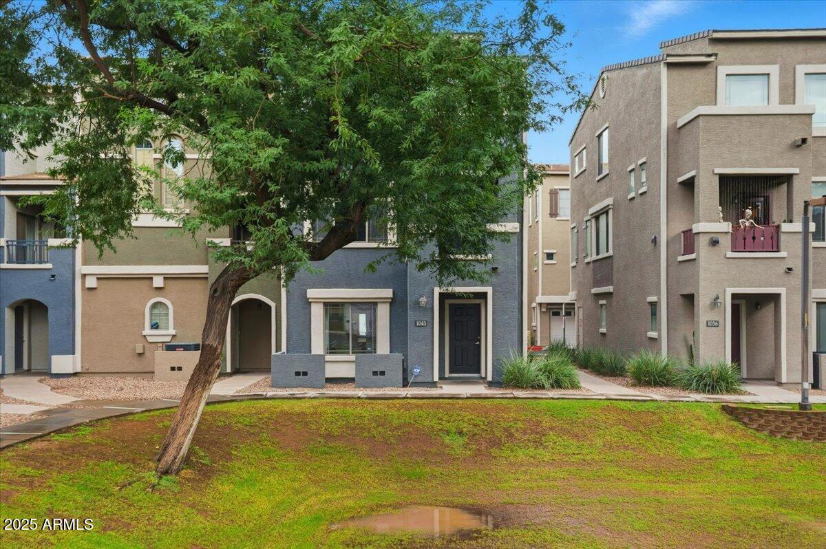 2401 East Rio Salado Parkway, Unit 1045 Tempe, AZ 85288 - Photo 2 of 41 a front view of a house with swimming pool