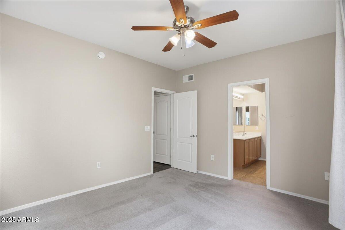 2401 East Rio Salado Parkway, Unit 1045 Tempe, AZ 85288 - Photo 21 of 41 an empty room with closet and a ceiling fan