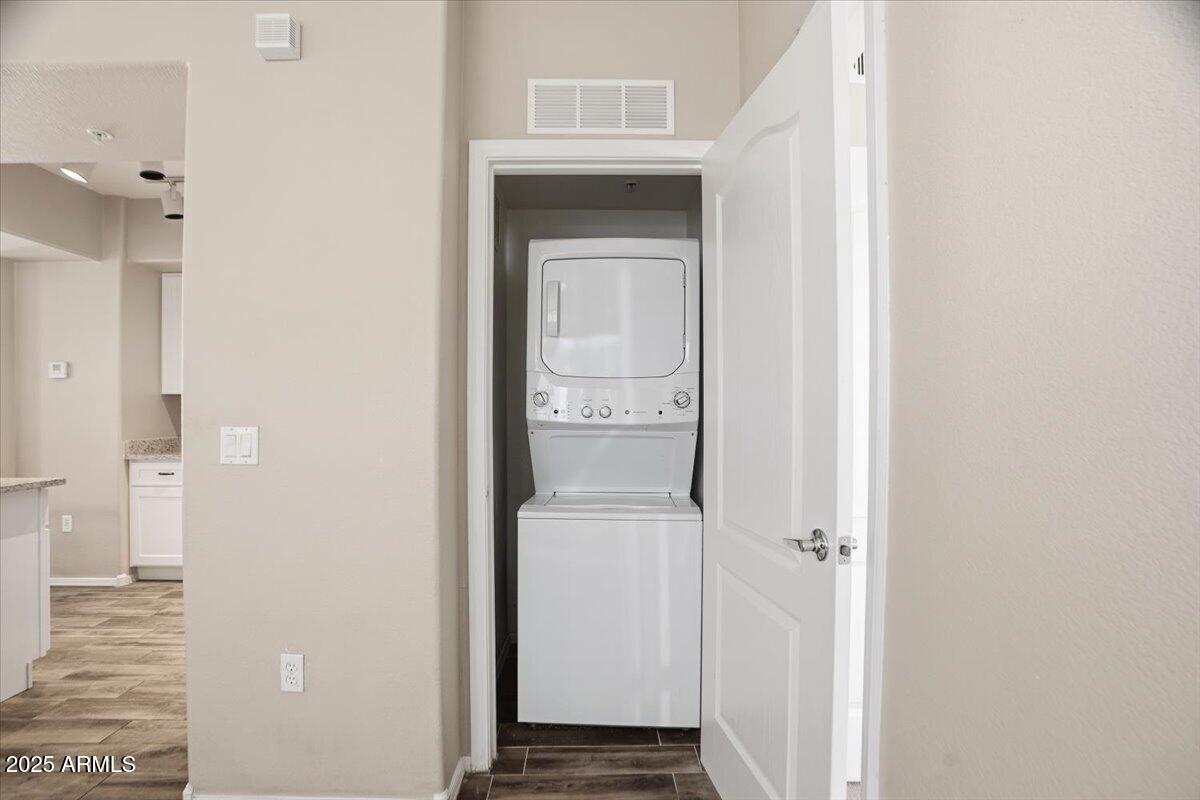 2401 East Rio Salado Parkway, Unit 1045 Tempe, AZ 85288 - Photo 26 of 41 a view of a hallway with a white cabinet and a door