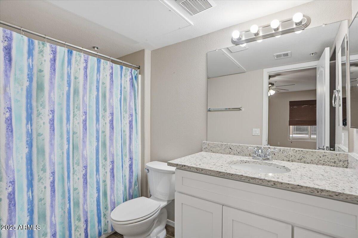 2401 East Rio Salado Parkway, Unit 1045 Tempe, AZ 85288 - Photo 35 of 41 a bathroom with a granite countertop sink and a mirror