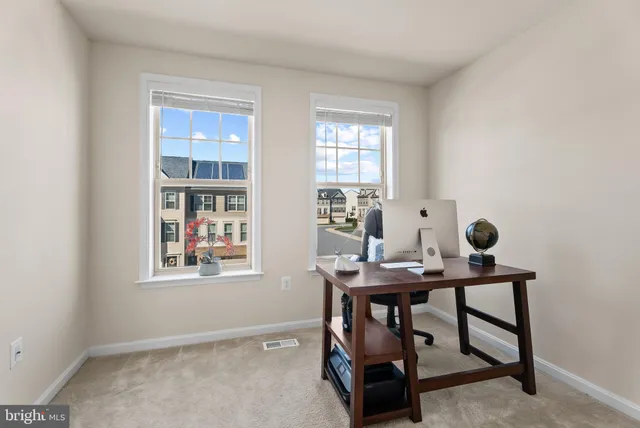 a view of a workspace with furniture