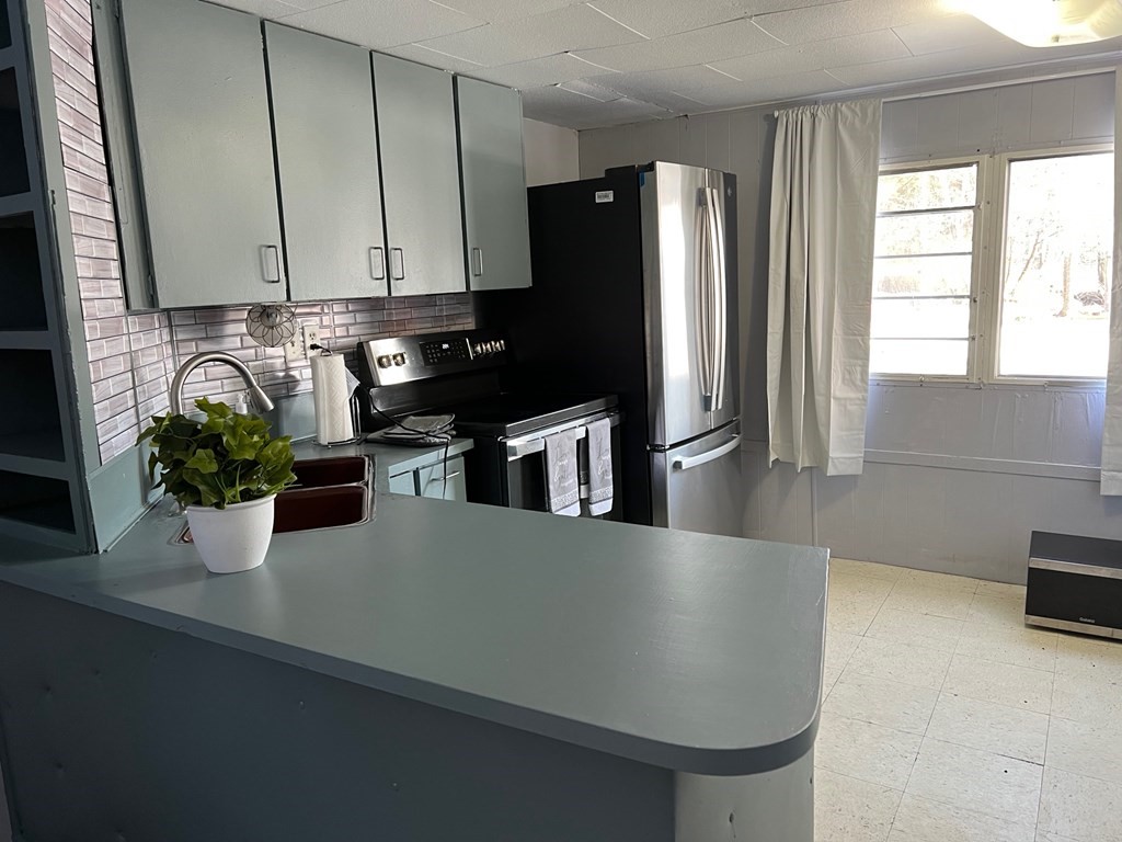 40 Acadia Road Gardner, MA 01440 - Photo 6 of 11 a kitchen with a refrigerator and potted