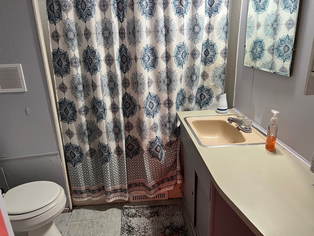 40 Acadia Road Gardner, MA 01440 - Photo 9 of 11 a bathroom with a granite countertop sink and a toilet