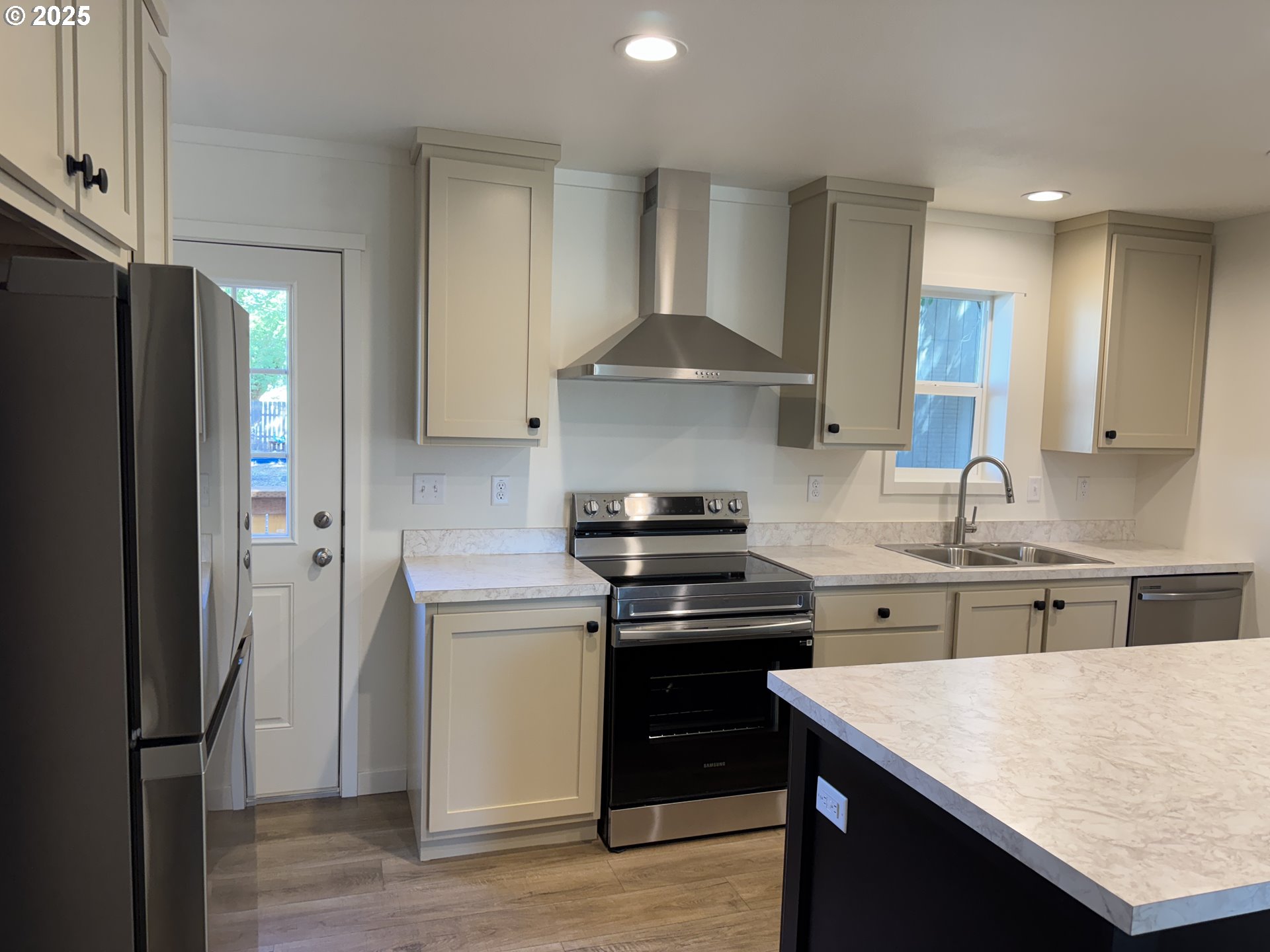 527 West Main Street Goldendale, WA 98620 - Photo 12 of 29 a kitchen with stainless steel appliances granite countertop a stove a refrigerator and a sink