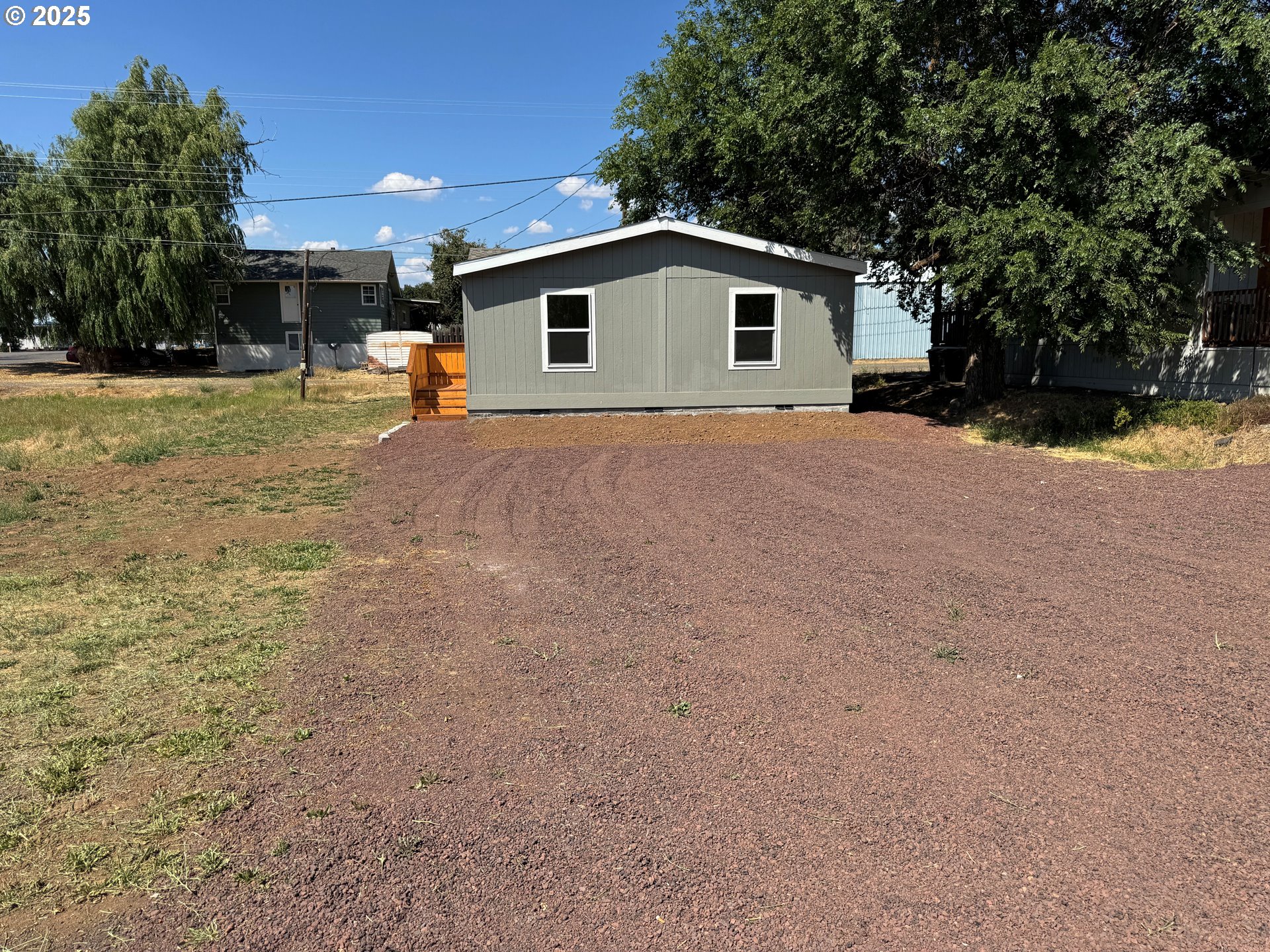 527 West Main Street Goldendale, WA 98620 - Photo 3 of 29 a view of a house with backyard and a tree