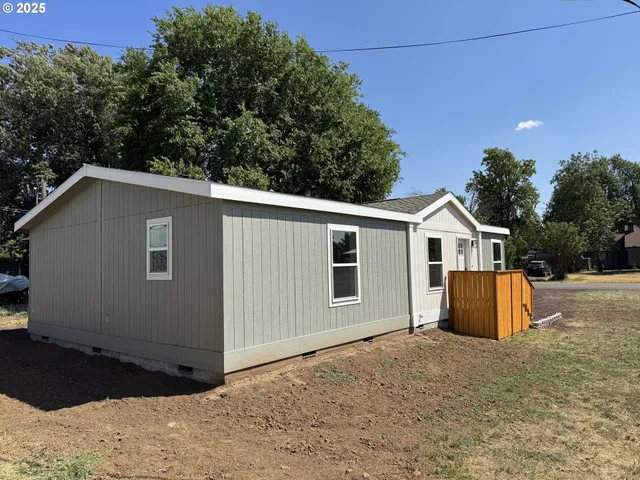 a backyard of a house with lots of green space