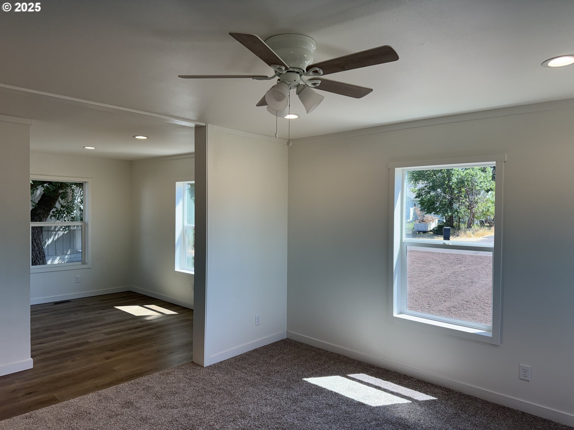 527 West Main Street Goldendale, WA 98620 - Photo 6 of 29 a view of an empty room with wooden floor and a window