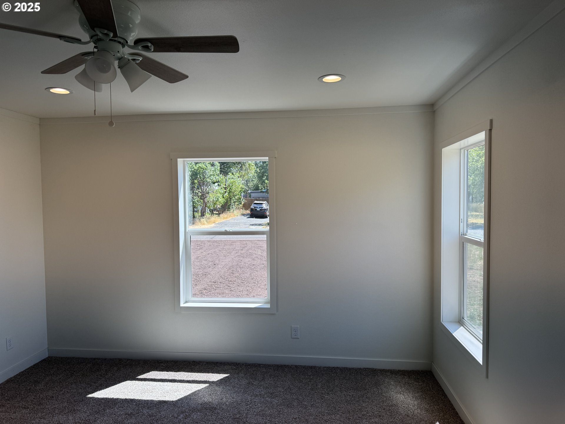 527 West Main Street Goldendale, WA 98620 - Photo 7 of 29 an empty room with a window and a ceiling fan