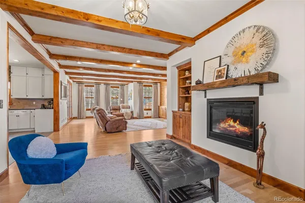 a kitchen with stainless steel appliances kitchen island granite countertop a dining table chairs and granite counter tops