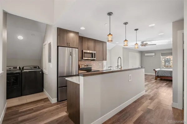 a very nice looking dining room with a large kitchen island