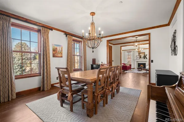 a workspace with wooden floor and windows