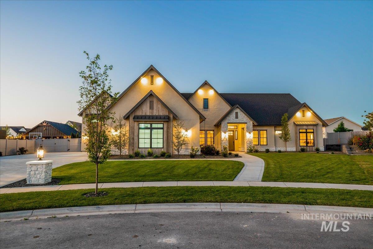 Modern inspired farmhouse featuring stone siding
