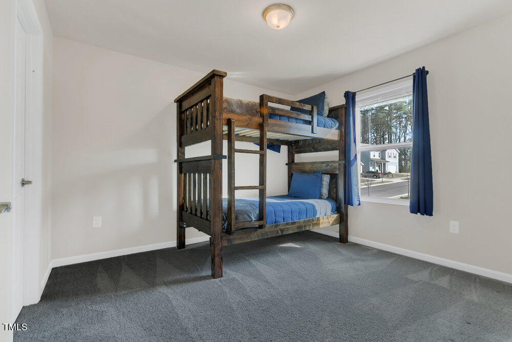 3512 Dragonfly River Raleigh, NC 27604 - Photo 10 of 37 a bedroom with a bunk bed and a window