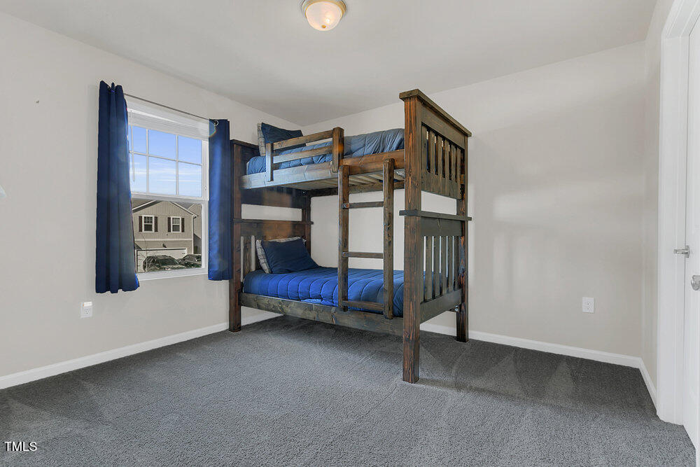 3512 Dragonfly River Raleigh, NC 27604 - Photo 11 of 37 a bedroom with a bed and a window