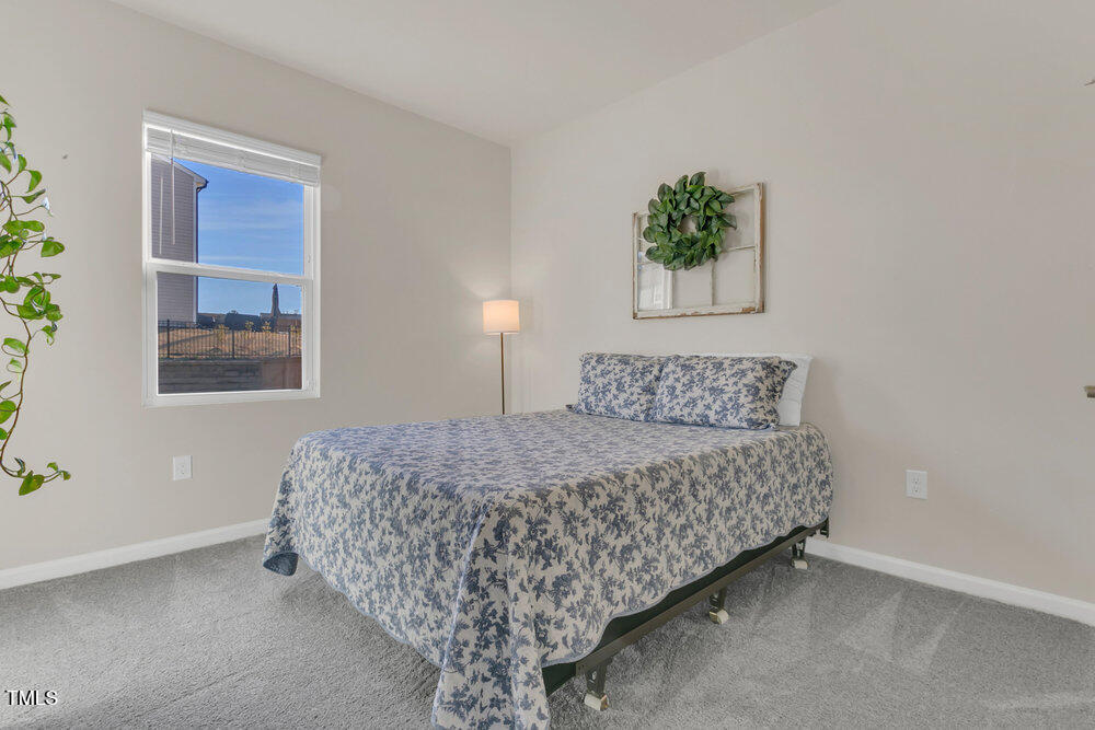 3512 Dragonfly River Raleigh, NC 27604 - Photo 20 of 37 a bedroom with a bed and a window