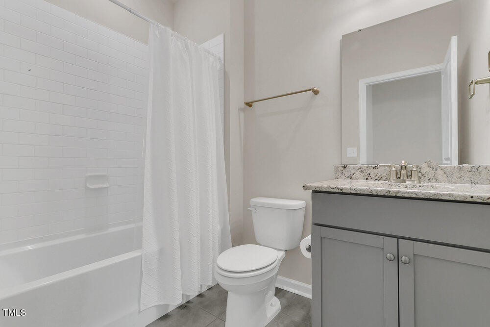 3512 Dragonfly River Raleigh, NC 27604 - Photo 23 of 37 a bathroom with a sink toilet and shower