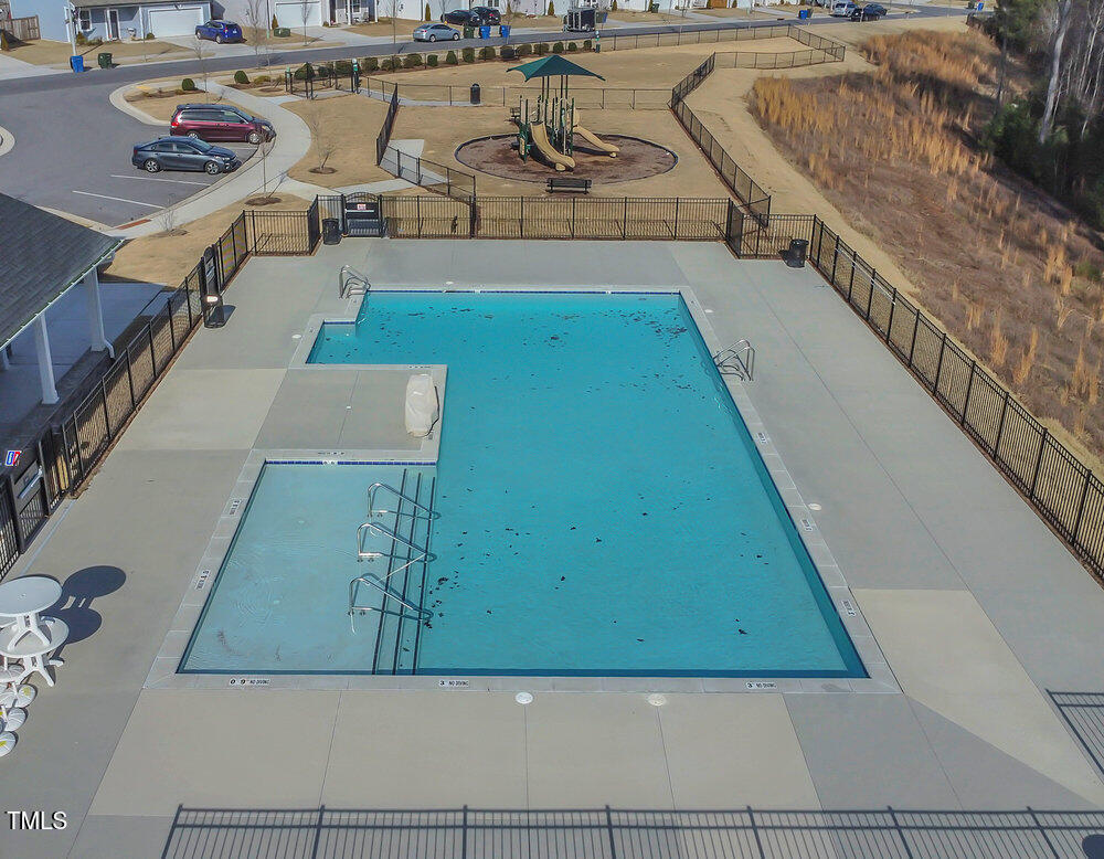 3512 Dragonfly River Raleigh, NC 27604 - Photo 28 of 37 a view of a swimming pool with seating area