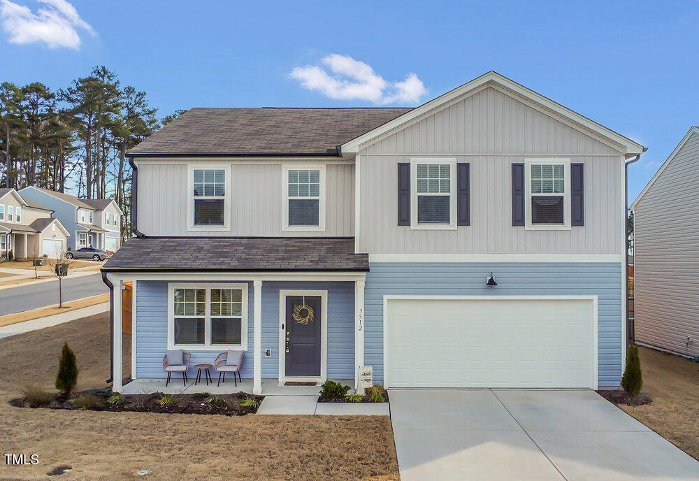 3512 Dragonfly River Raleigh, NC 27604 - Photo 3 of 37 a front view of a house with a yard
