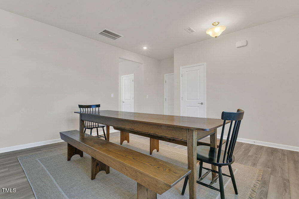 3512 Dragonfly River Raleigh, NC 27604 - Photo 4 of 37 a view of a dining room with furniture
