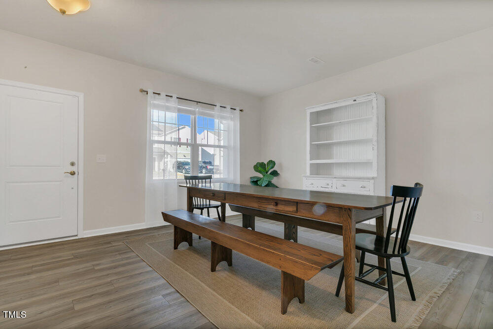 3512 Dragonfly River Raleigh, NC 27604 - Photo 5 of 37 a dining room with furniture and window