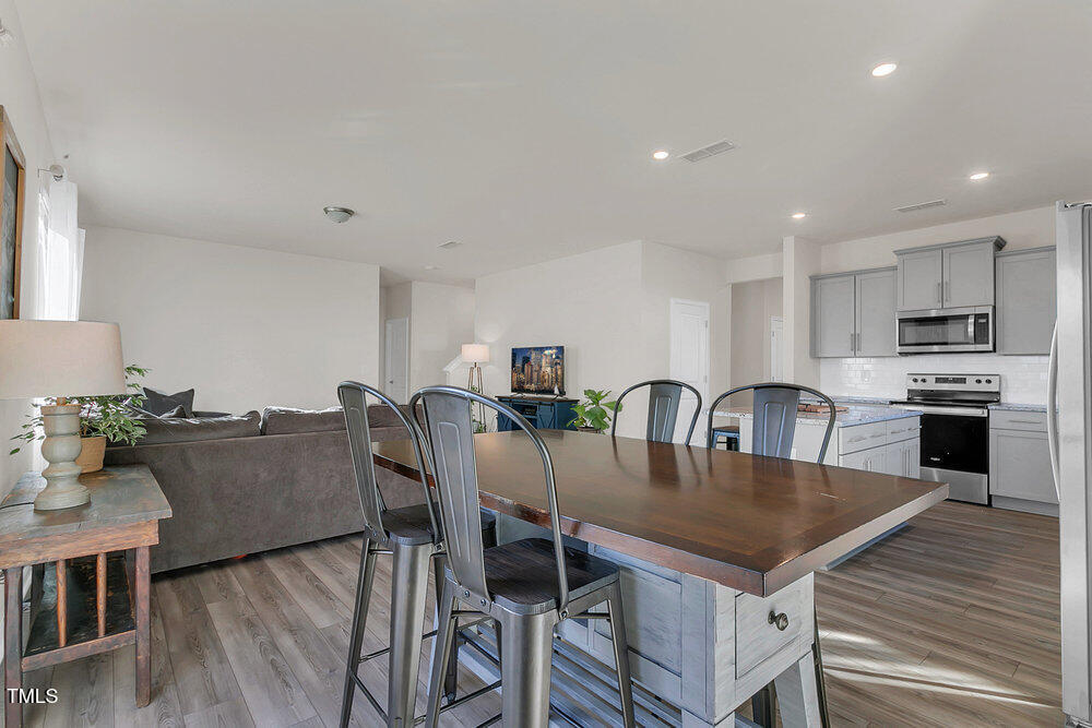 3512 Dragonfly River Raleigh, NC 27604 - Photo 6 of 37 a view of kitchen dining table and chairs