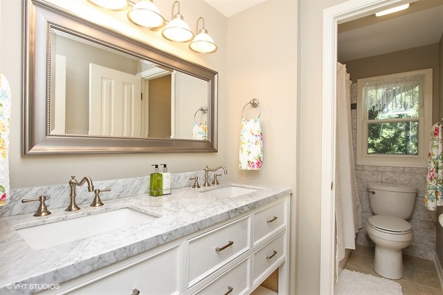 172 Stonegate Road Trout Valley, IL 60013 - Photo 13 of 20 a bathroom with a granite countertop sink toilet and mirror