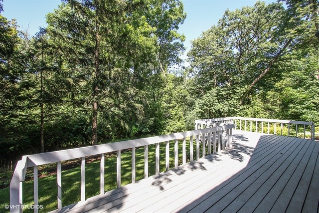 172 Stonegate Road Trout Valley, IL 60013 - Photo 16 of 20 a view of a deck with two chairs and wooden floor
