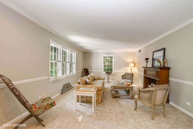 172 Stonegate Road Trout Valley, IL 60013 - Photo 5 of 20 a living room with furniture a window and a flat screen tv