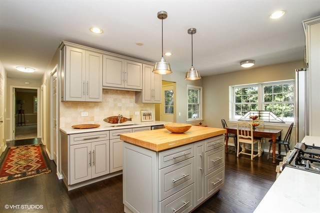 172 Stonegate Road Trout Valley, IL 60013 - Photo 6 of 20 a kitchen that has a lot of cabinets in it and a wooden floor