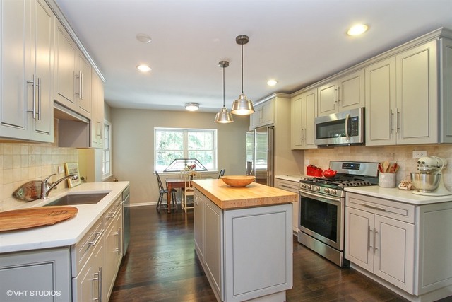 172 Stonegate Road Trout Valley, IL 60013 - Photo 7 of 20 a kitchen with a sink stove and cabinets