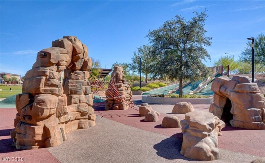 1100 East Sunset Road Henderson, NV 89011 - Photo 52 of 63 Adventure awaits at the neighborhood community playground designed with climbing walls and slides.