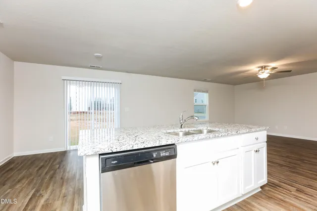 a bathroom with a sink a vanity and a mirror